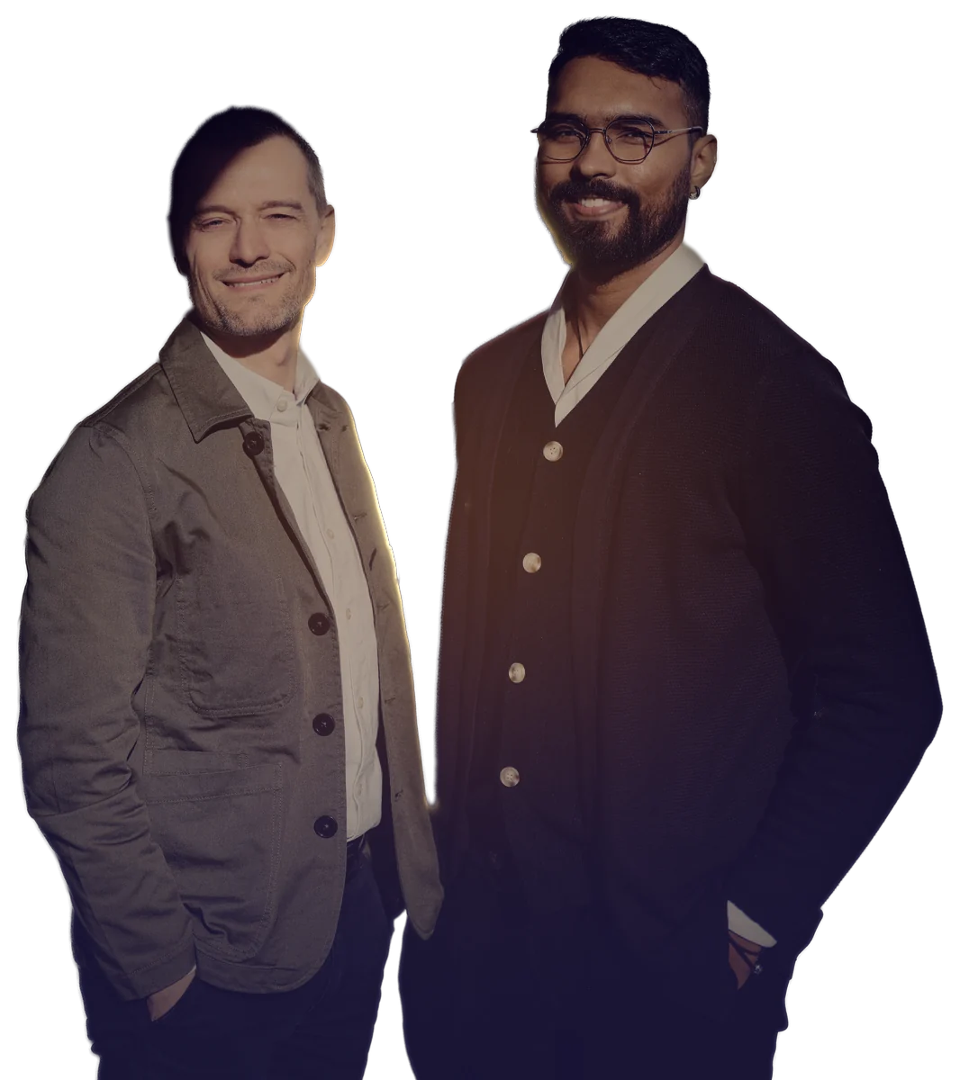 Jörg Vogel, CTO, and Adarsh Raj, CEO of Vāsuqi, standing side by side at dusk, the low sun behind them